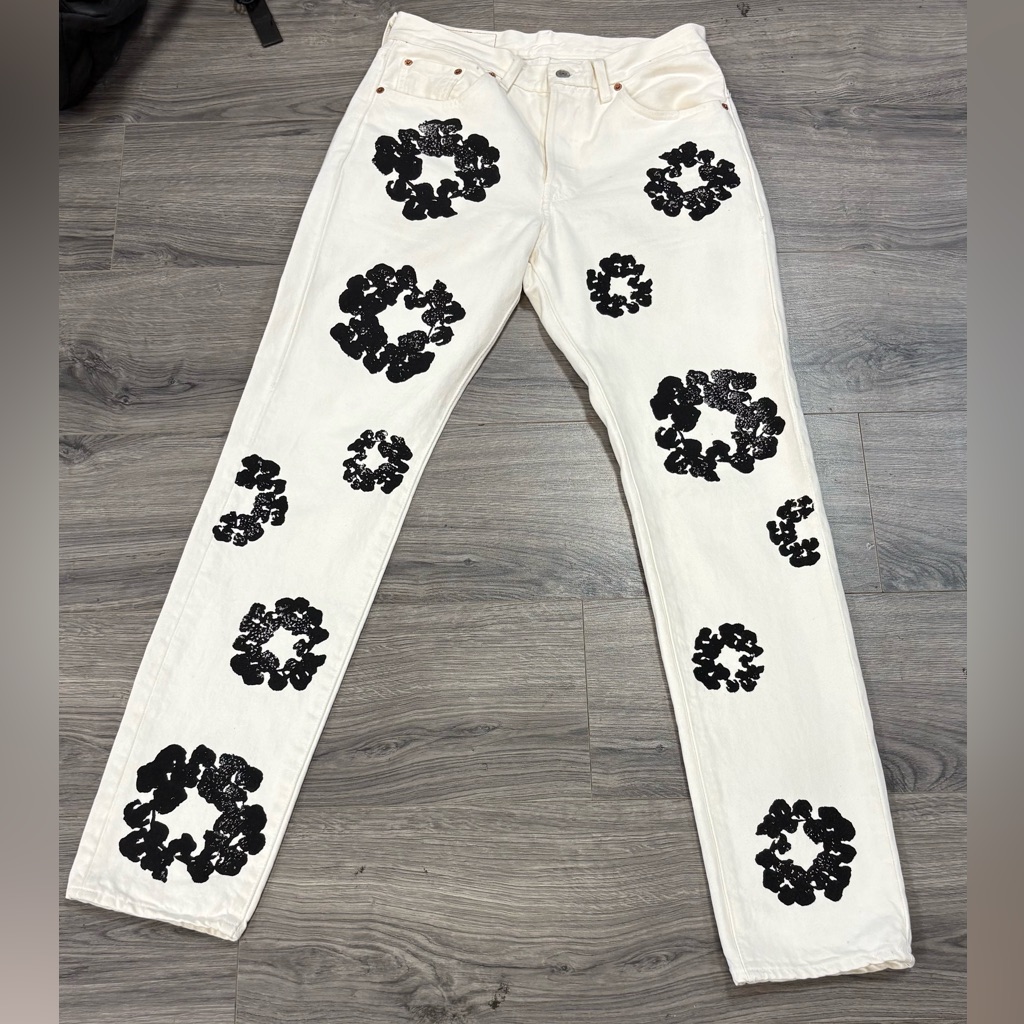 Stylish White Denim Tears Cotton Wreath Jeans With Black Floral Design